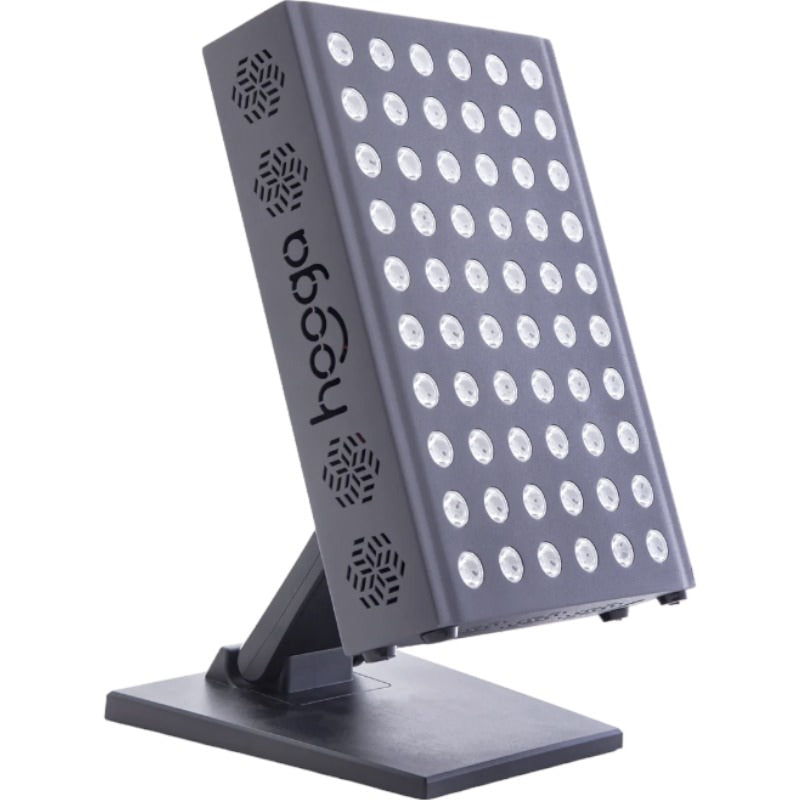 Hooga Pro300 Red light & infrared light therapy device sits on a table top. The light is off