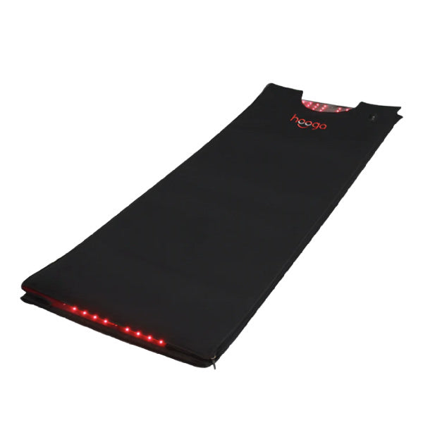 hooga's red light therapy pod lit up with infrared lights. It lays flat like a sleeping bag.
