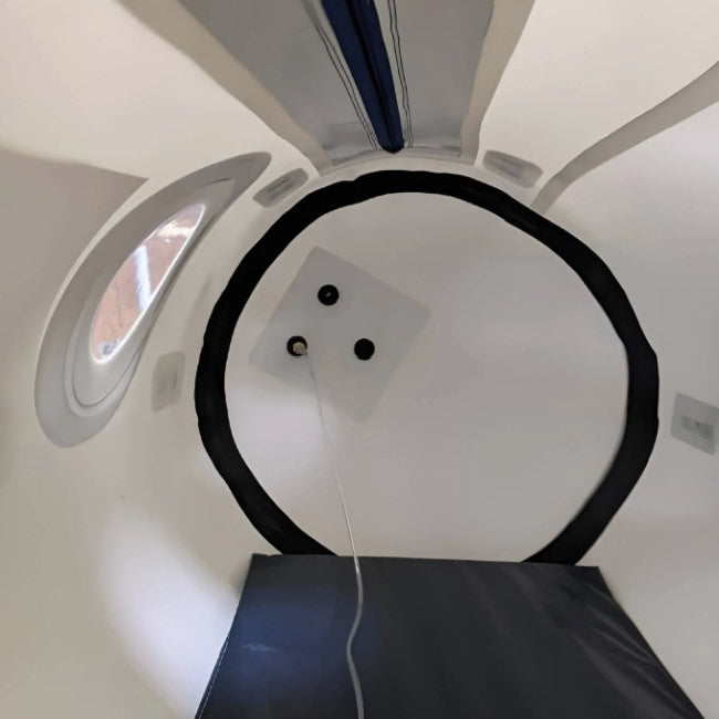 An inside view of newtowne's hyperbaric chamber. An inside mat is shown with a window