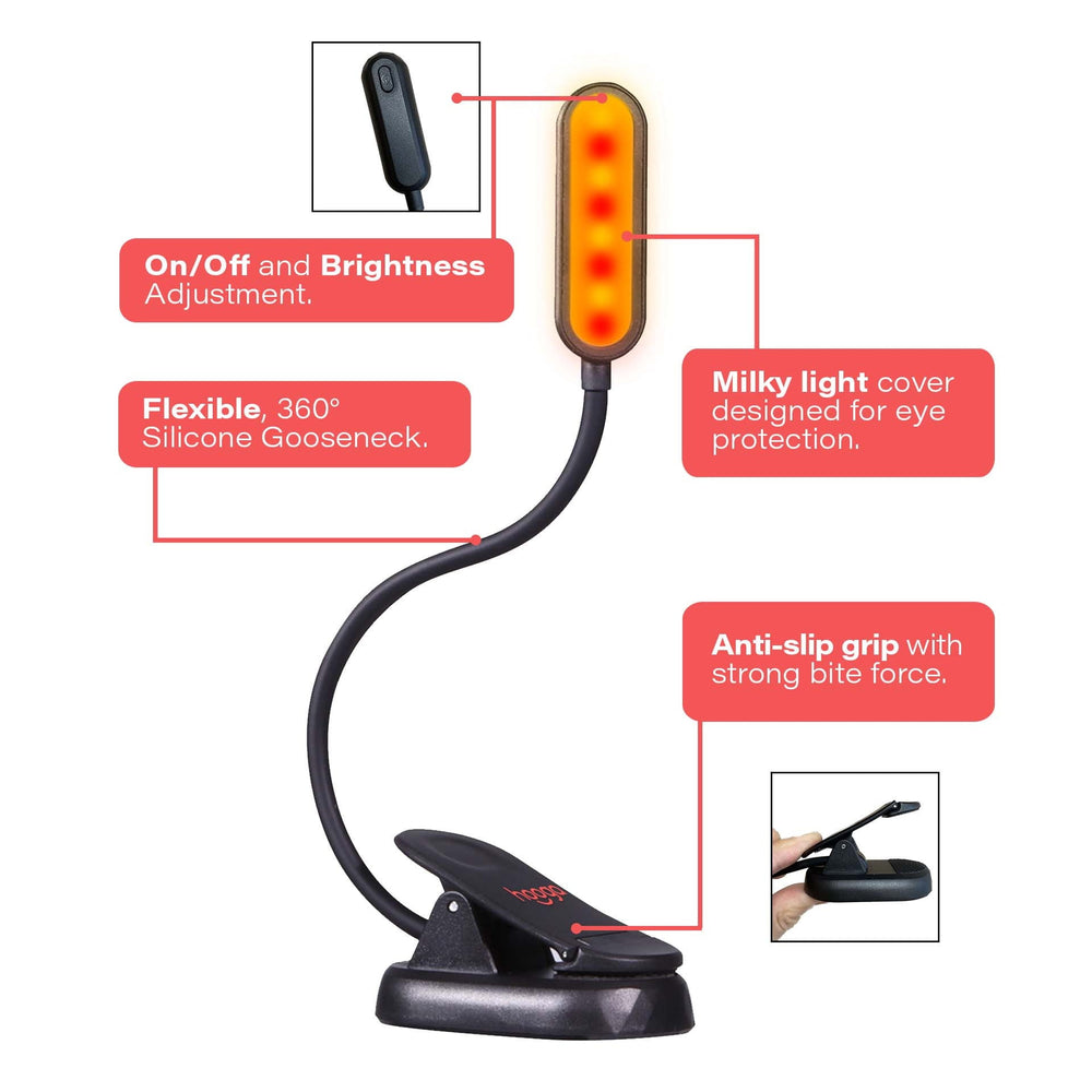 Hooga Amber and Red clip-on book light glowing in amber reading mode