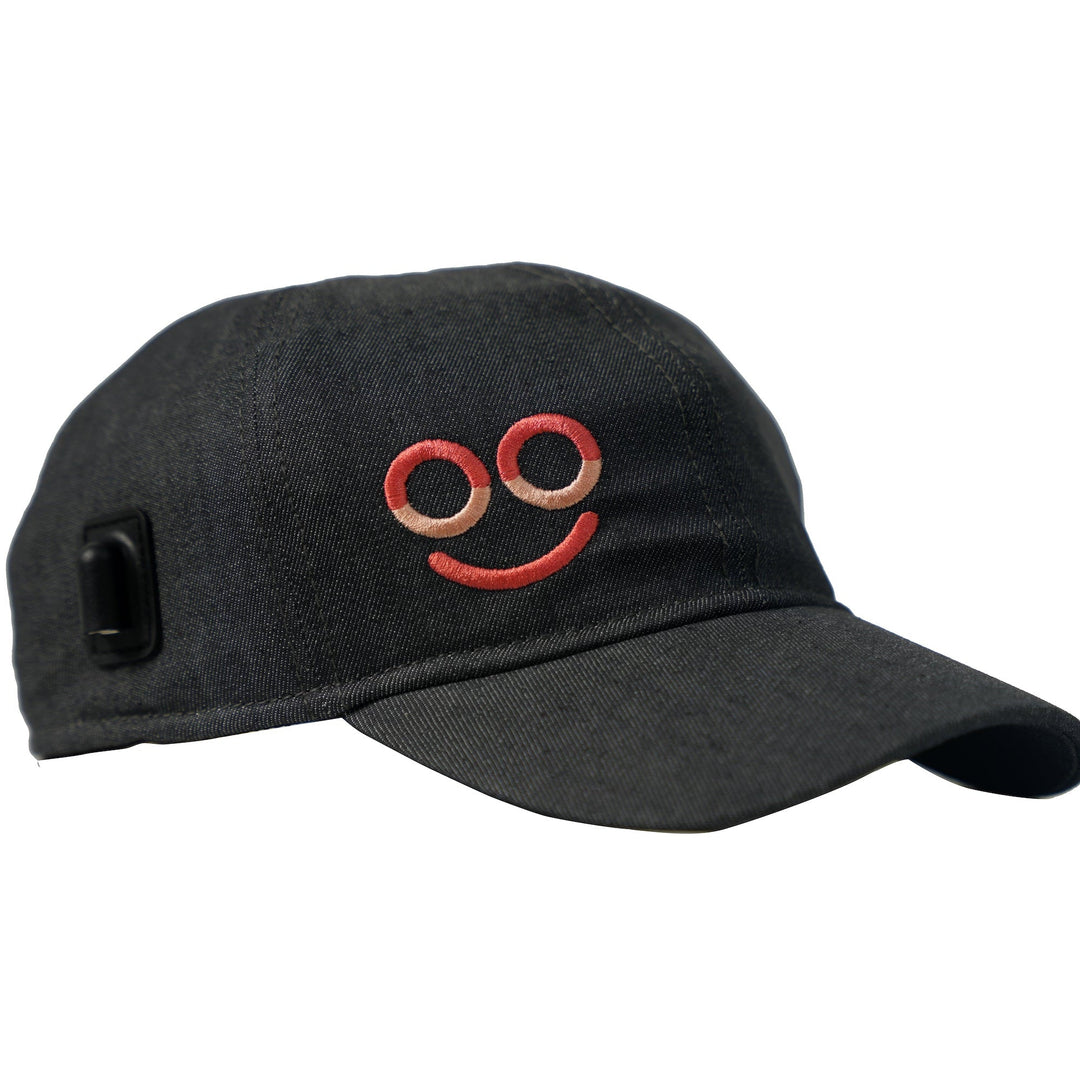 Front angled view of the black Hooga ColorWave light therapy hat with red logo