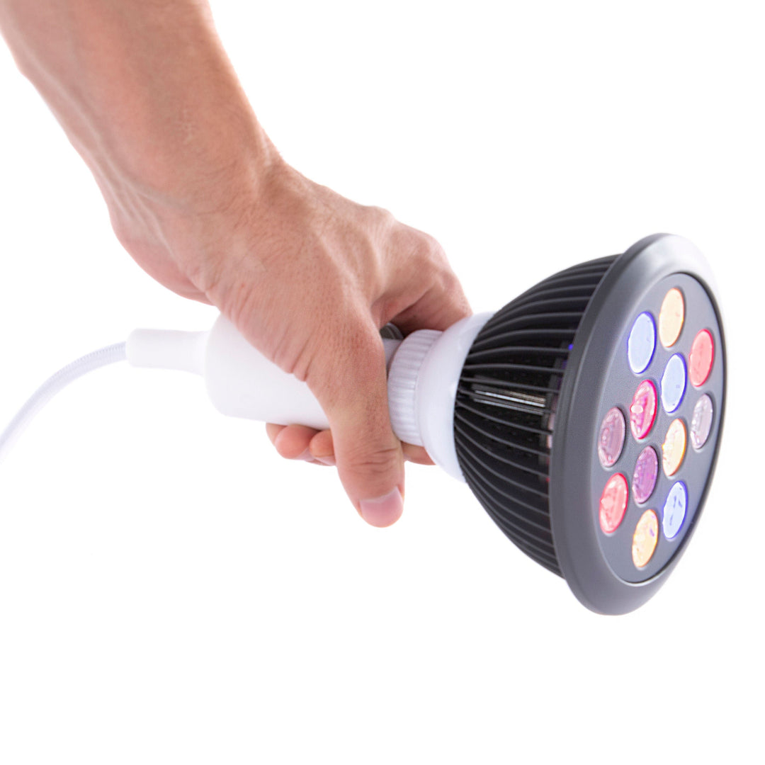 Hand holding the Hooga HG24 4-in-1 light therapy bulb by its socket