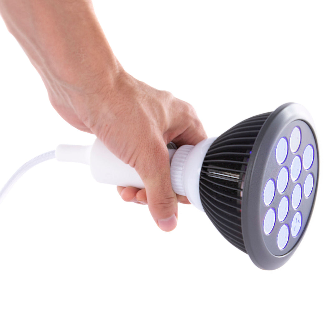 Hooga HG24 blue light therapy bulb held in hand to show its compact size
