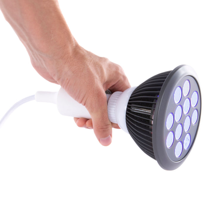 Hooga HG24 blue light therapy bulb held in hand to show its compact size