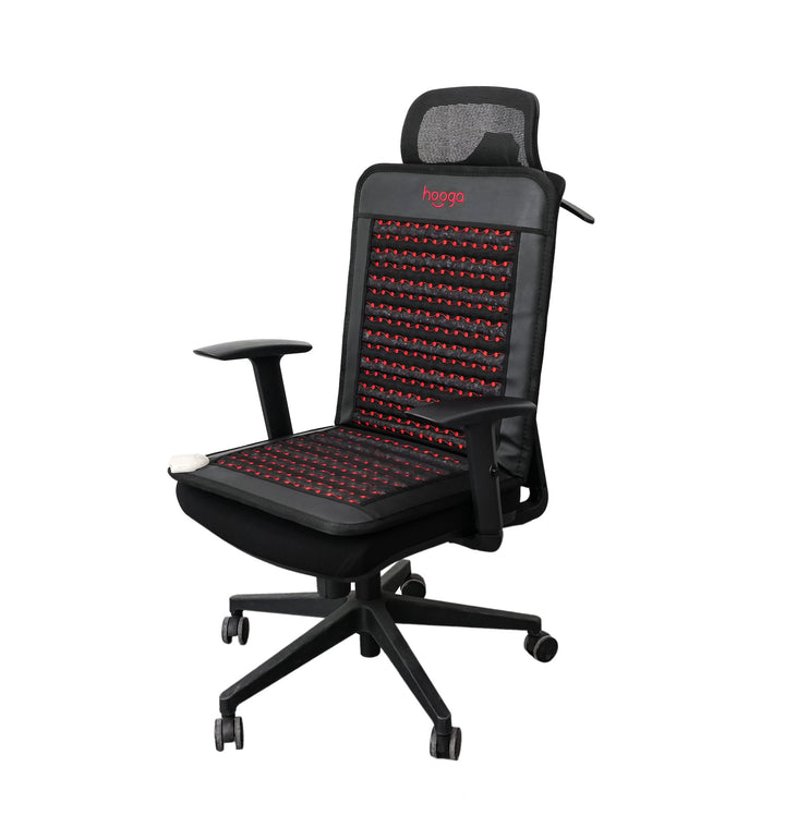 Hooga infrared PEMF chair mat draped over an office chair in a work setup