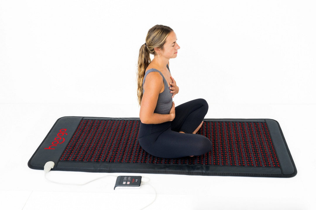Person lying on the Hooga PEMF Mat with Infrared Heat during a full-body session