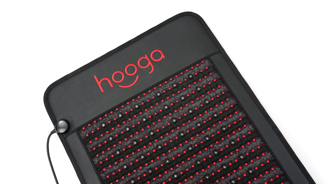 Corner detail of the Hooga Red Light PEMF Mat with LEDs, amethyst crystals and cable port