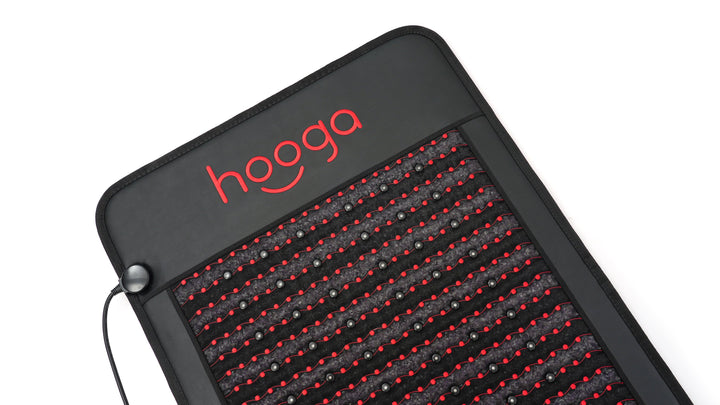 Corner detail of the Hooga Red Light PEMF Mat with LEDs, amethyst crystals and cable port