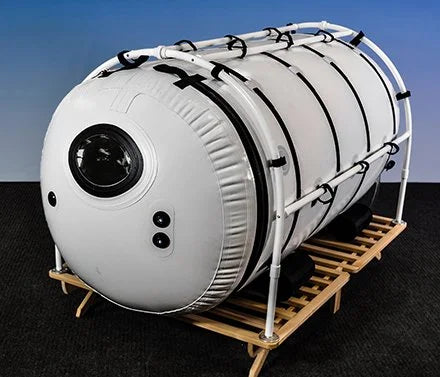 Summit to Sea Grand Dive Pro 46-inch hyperbaric chamber in PVC frame on elevated platform